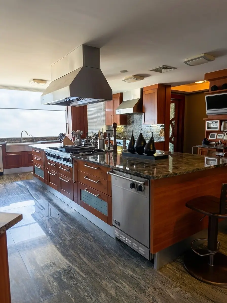 Professional gourmet kitchen island with Viking range and granite countertops